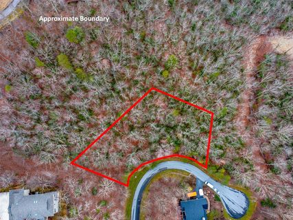 214 Chimney Crossing active lot in Champion Hills, Hendersonville, NC