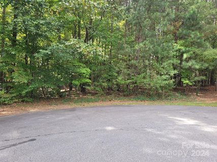 000 Wood Thrush Lane sold lot in Whippoorwill Woods, Mooresville, NC