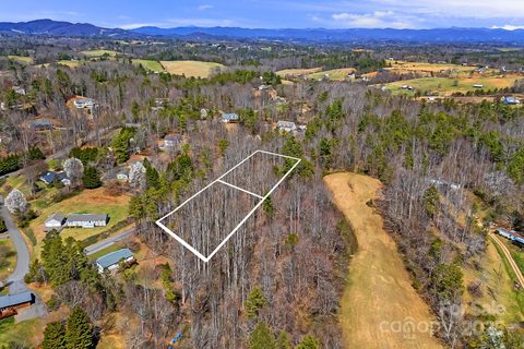 Lot 63 64 Quiet Woods Drive sold lot in Whispering Pines, Leicester, NC