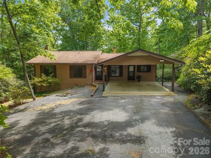 32 Honeysuckle Ridge Road active home in Knob Creek, Pisgah Forest, NC